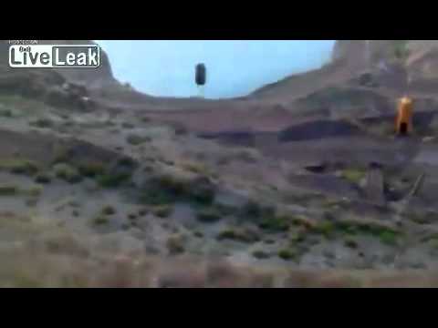 Huge Tire Bouncing Downhill Into Lake